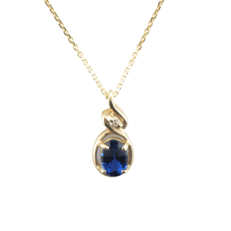 Created Oval Blue Sapphire & Diamond Pendant set in 10k Yellow Gold